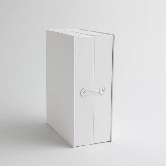A front view of the keepsake organizer with a secure string closure, designed to keep precious baby mementos safe and neatly stored.