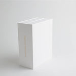 A book-style keepsake box standing upright, featuring "Timeless Memories" embossed in gold, adding a vintage and elegant touch.