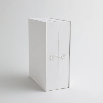 A front view of the keepsake organizer with a secure string closure, designed to keep precious baby mementos safe and neatly stored.