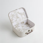 An elegant white vintage memory suitcase with a safari-themed interior, featuring illustrations of giraffes, elephants, and jungle foliage.